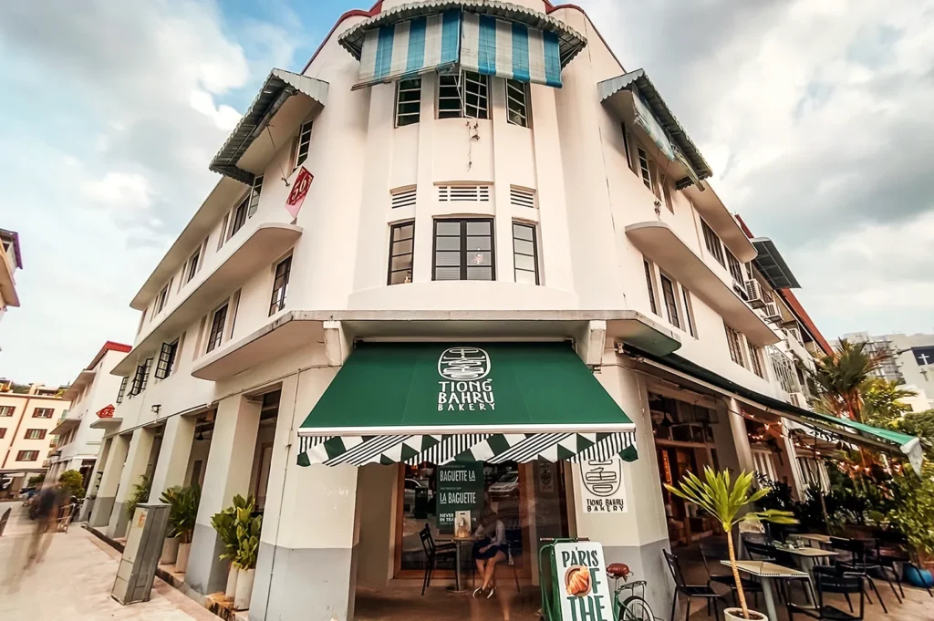 Historic Tiong Bahru Bakery café in Singapore’s Art Deco district with green awning and outdoor tables