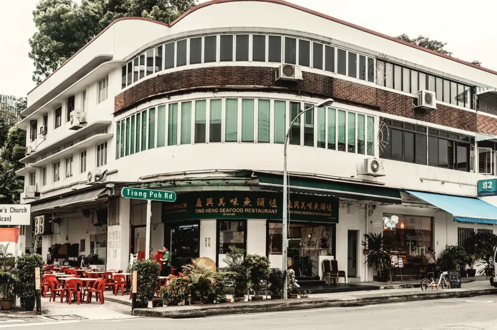 Ting Heng Seafood Restaurant at Tiong Poh Road, Singapore — classic corner shophouse with outdoor red seating and neighboring Drips Bakery Café, highlighting local dining and heritage architecture.