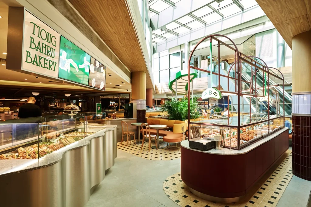 Modern Tiong Bahru Bakery café interior with skylight, pastry counter, and cozy seating in Singapore mall