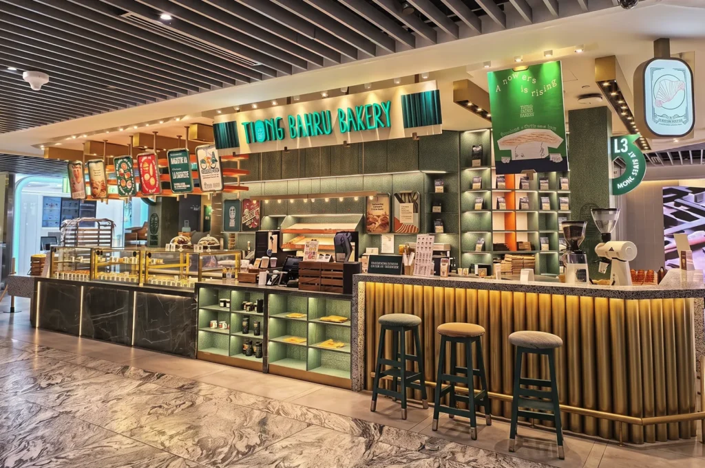 Tiong Bahru Bakery Singapore counter with neon sign, pastry display, and chic café design