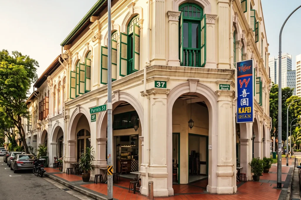 YY Kafei Dian café housed in colonial shophouse at 37 Purvis Street, Singapore, with green shutters and arched walkways — heritage architecture blending tradition and modern dining.