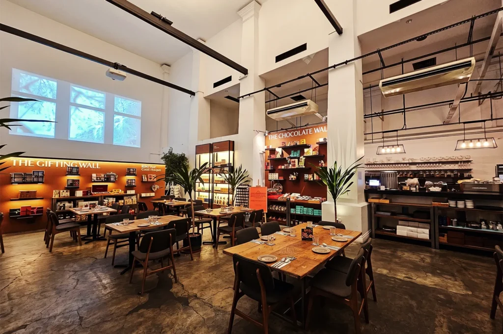 Dining area at The Dempsey Project next to The Gifting Wall and The Chocolate Wall retail displays.
